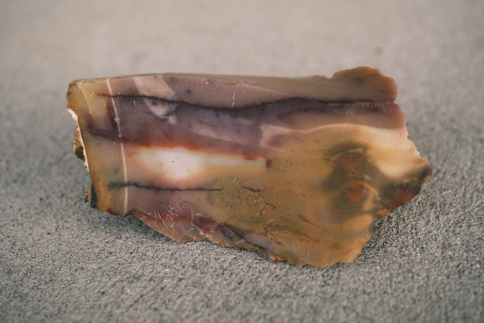 Rough natural stone with earthy tones, evoking Ohio Flint Ridge flint