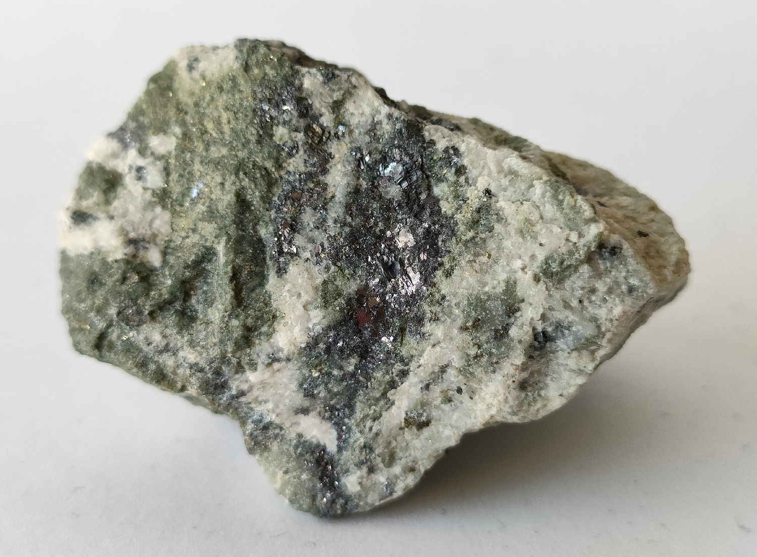 Silvery grey galena crystals with quartz, showing the bright mirror-like metallic luster of a sulfide ore mineral