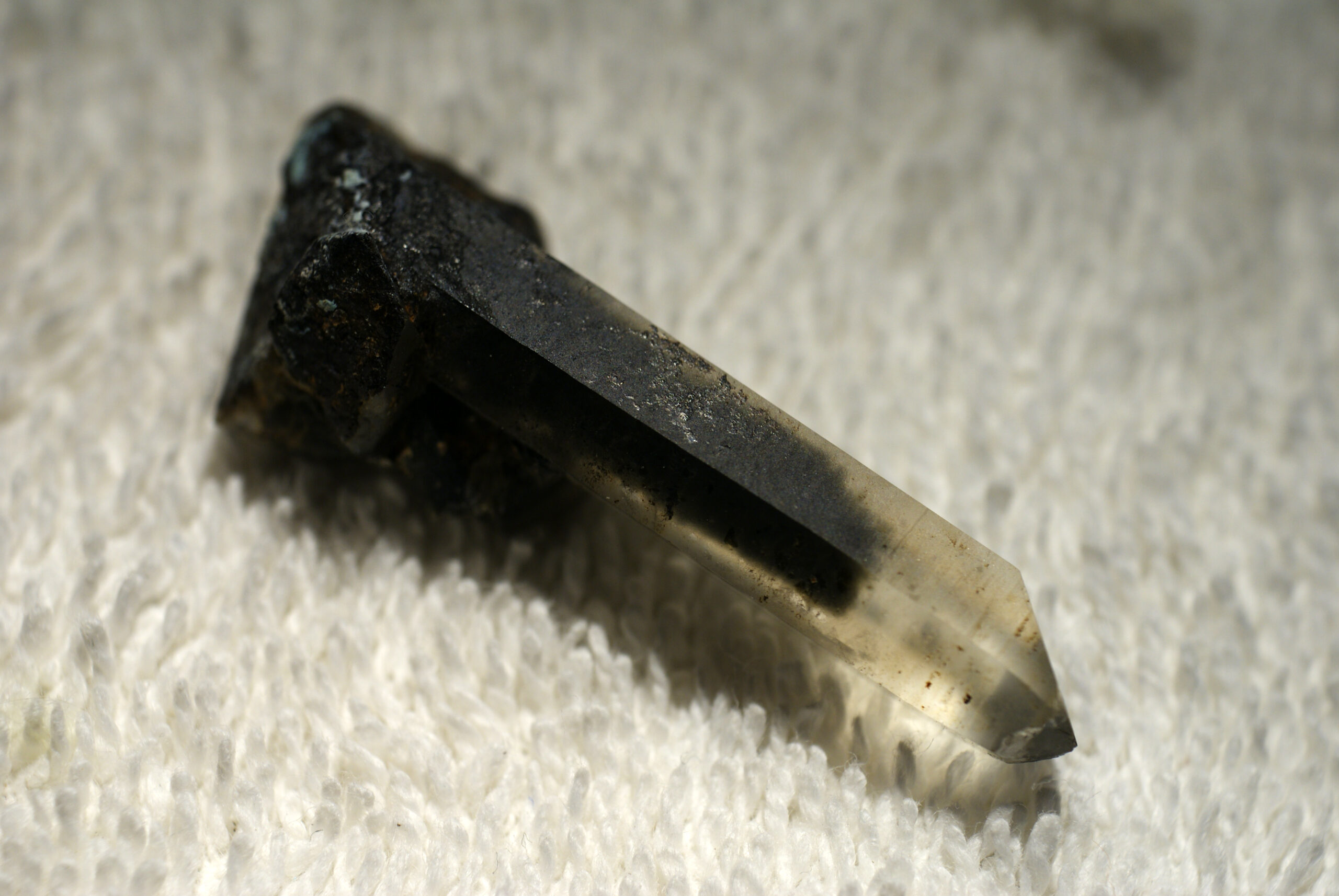 Clear quartz crystal containing a green chlorite inclusion